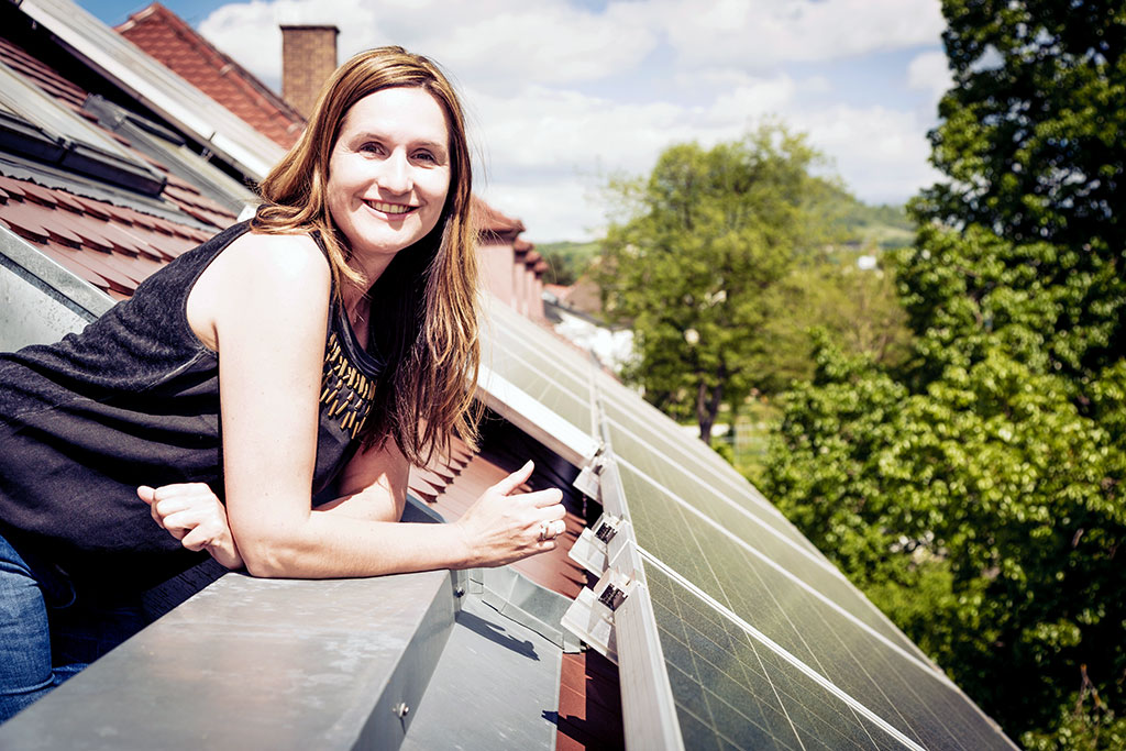 happy homeowner with solar panels